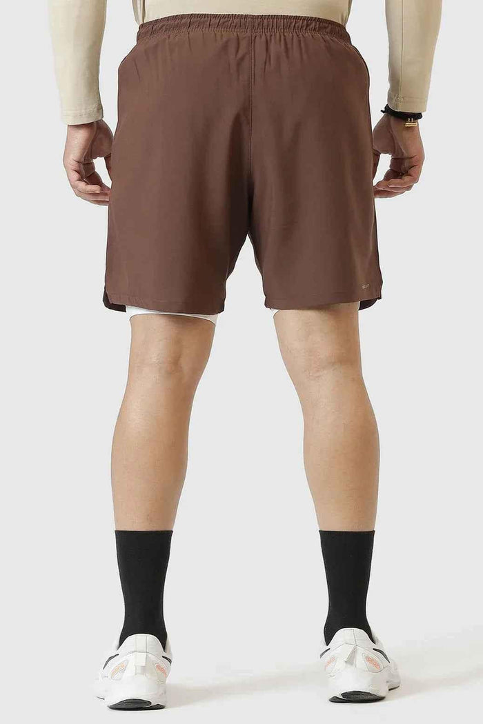 Brown 2-in-1 compression shorts by Fuaark NZ with a snug fit and flexible fabric for active wear and comfort.
