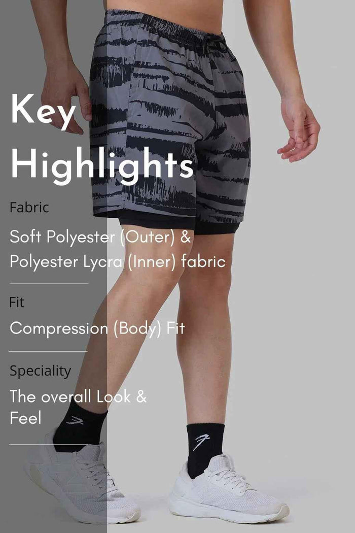Fuaark Nz 2-in-1 printed compression shorts in gold and grey, featuring a sleek design and comfortable fit for active wear.