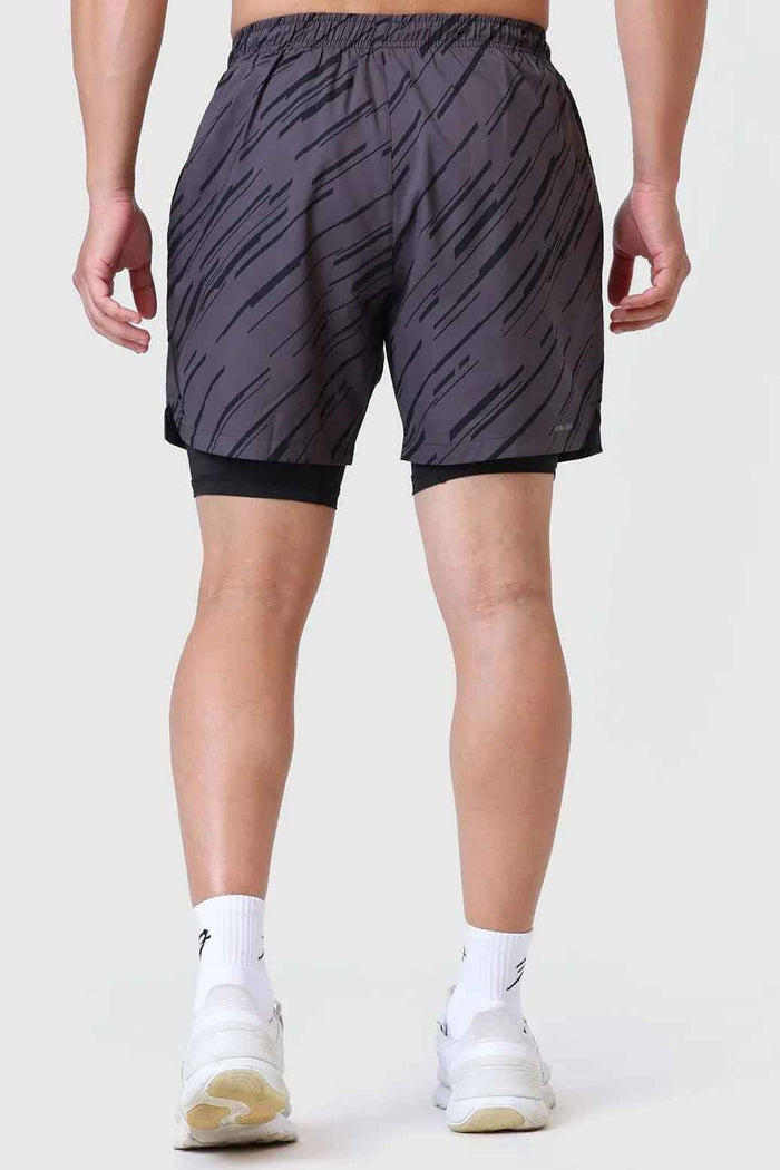 Fuaark Nz 2-in-1 printed compression shorts in graphite, featuring a sleek design and comfortable fit for active wear.