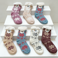 24 pairs of women's fuzzy winter slippers with soft, warm fabric and grippers for non-slip comfort from dealonline.co.nz