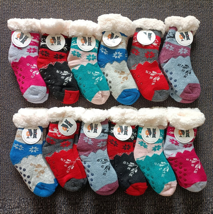 Four pairs of dealonlinenz kids fuzzy winter slippers with soft, warm fabric and non-slip grippers for safety and comfort.