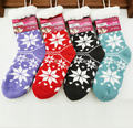 Four pairs of ladies thermal cozy socks from dealonline.co.nz, featuring a 4.7 tog rating for warmth and comfort.