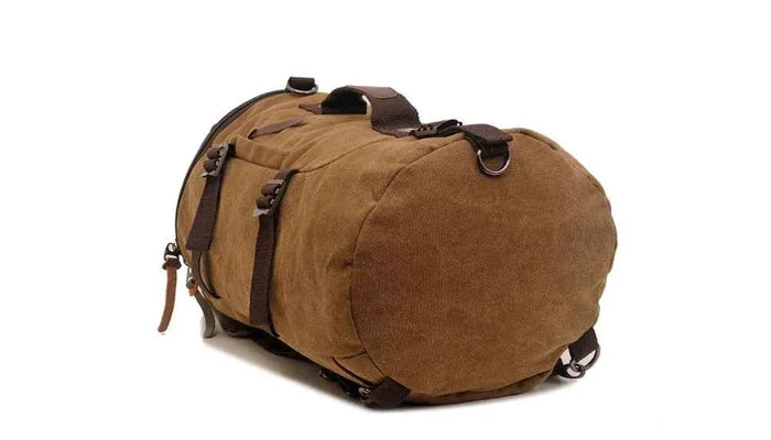 Brown 50L canvas hiking backpack with leather accents, retro style travel rucksack for men by Mead's Supply & Equipment Outfitters.