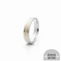 6mm silver Greek key stainless steel band ring by Glitters on a gold background, showcasing intricate design and polished finish.