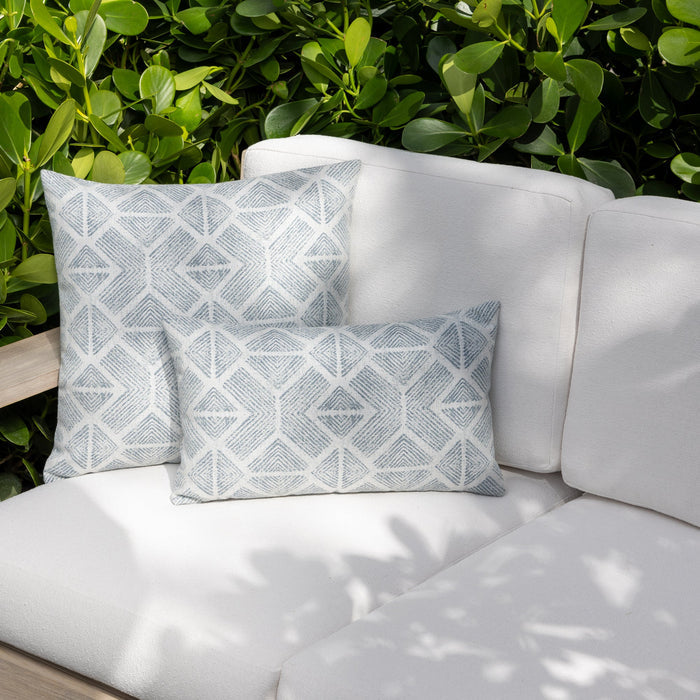 Outdoor image of pillows in Textured outdoor safe fabric featuring geometric tribal patterns in stream blue - Bakuba Stream by Elaine Smith