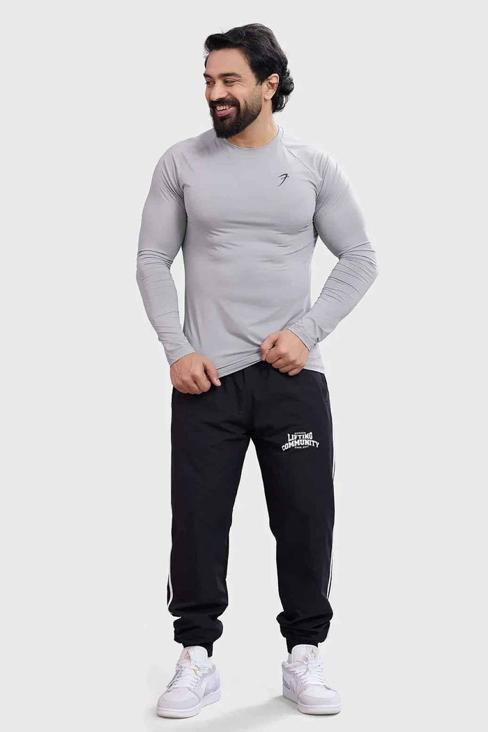 Light grey Bare Nylon full-sleeves T-shirt by Fuaark Nz, showing a close-up of the soft, fitted fabric and long sleeves.