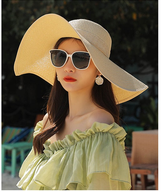 Beige women's straw sun hat with wide brim, floppy derby style, perfect for summer beach or outdoor wear by dealonline.co.nz