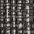Swatch image of Black outdoor pillow with geometric diamond pattern, lumbar size for sleek outdoor styling