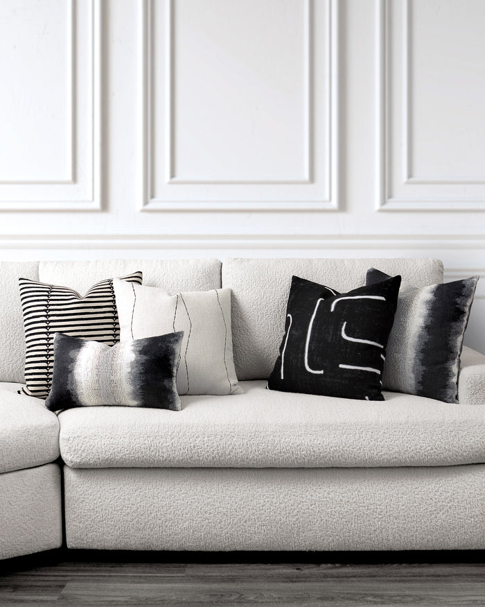 indoor environmental image of charcoal and ivory coordinated pillow group by Elaine
