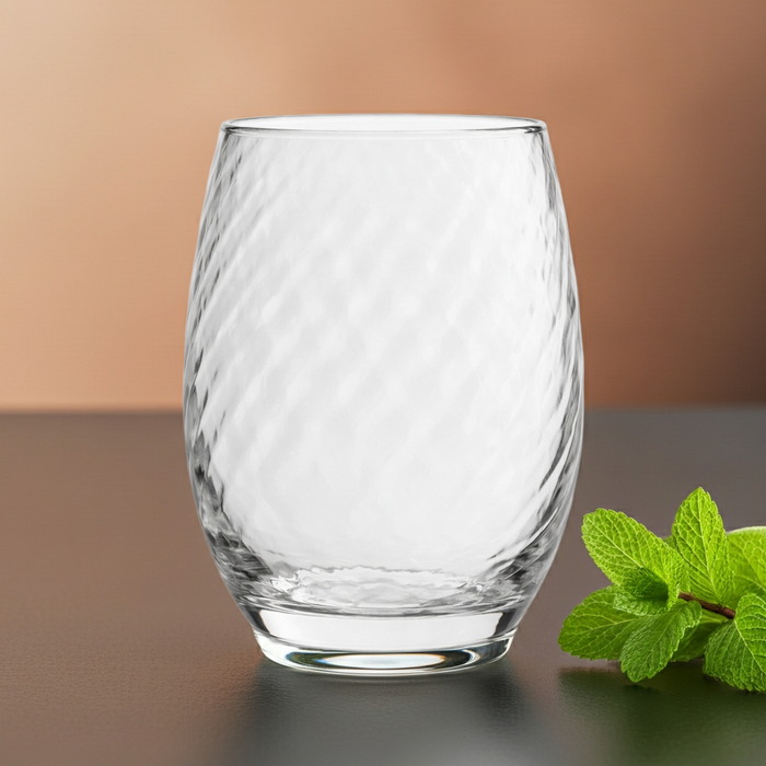 Clear textured glass tumbler with diagonal pattern, 420ml capacity, by Nest & Stem Homewares, showing the elegant design and clarity.