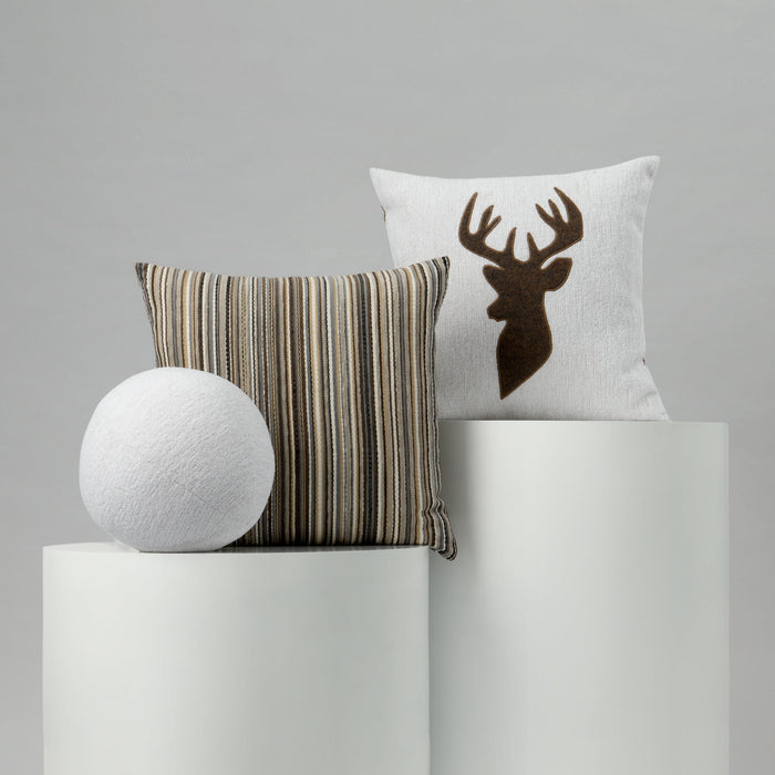 Decorative pillows with a striped pattern and deer design on a gray background
