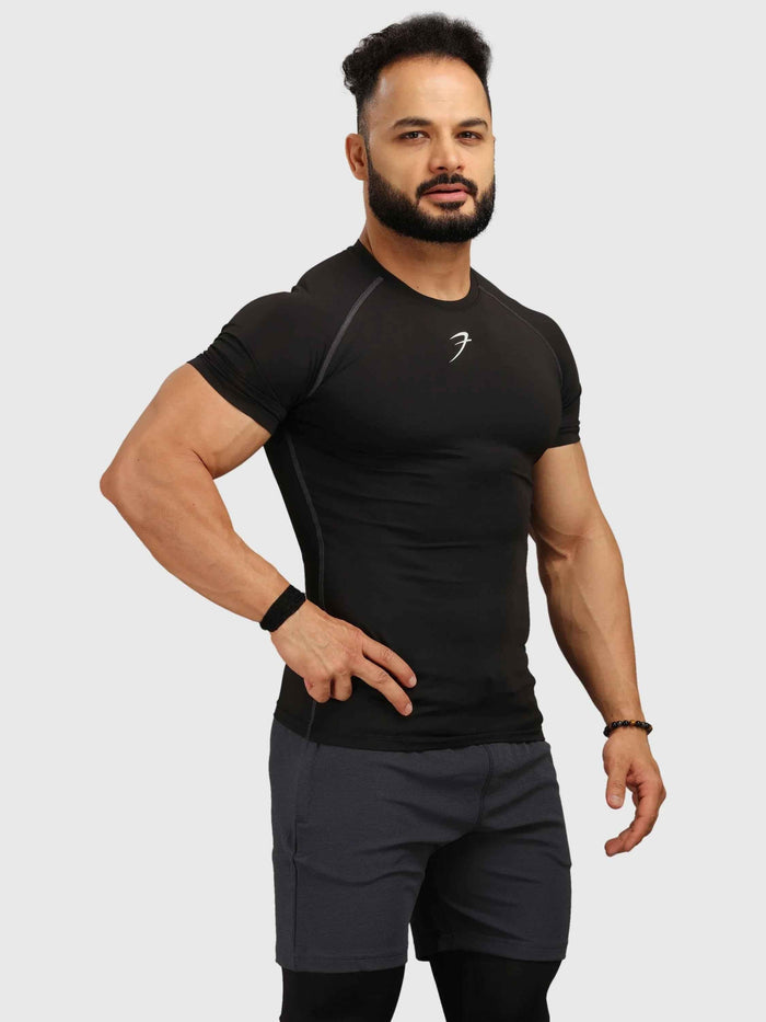Black Fuaark Nz compression T-shirt for men, featuring a snug fit and breathable fabric for athletic performance.