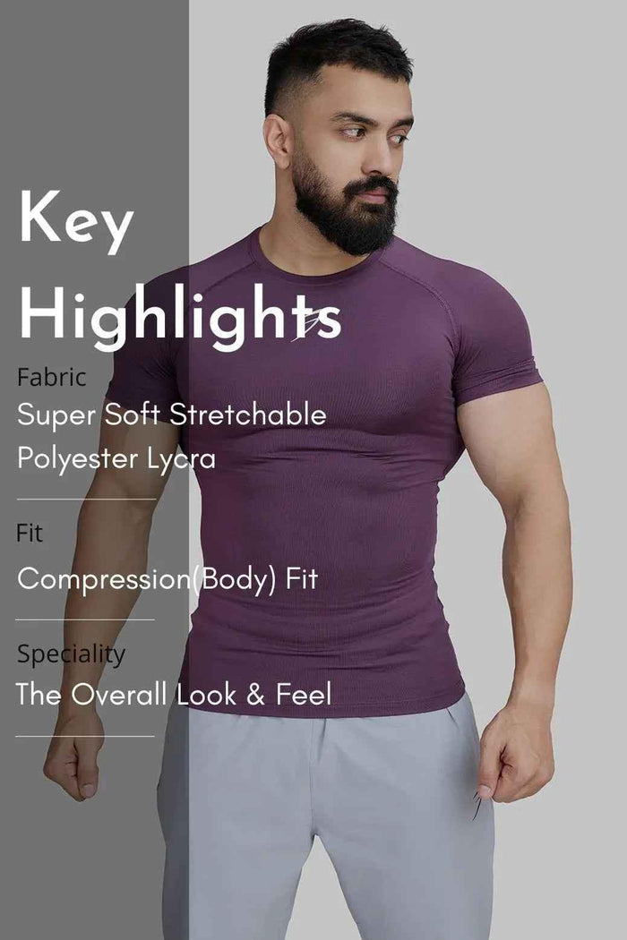 Fuaark Nz compression T-shirt in plum color, fitted athletic T-shirt with short sleeves, designed for comfort and support.
