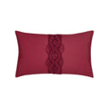 Red outdoor pillow with solid texture, lumbar size for vibrant holiday accents