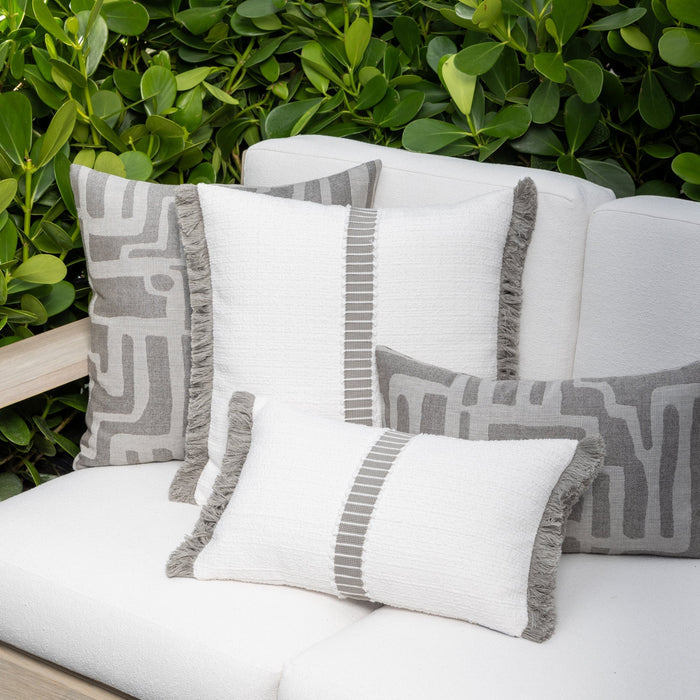 Luxury pewter gray textured woven decorative pillow on an indoor and outdoor sofa, featuring commercial grade construction for luxury hotel and resort design