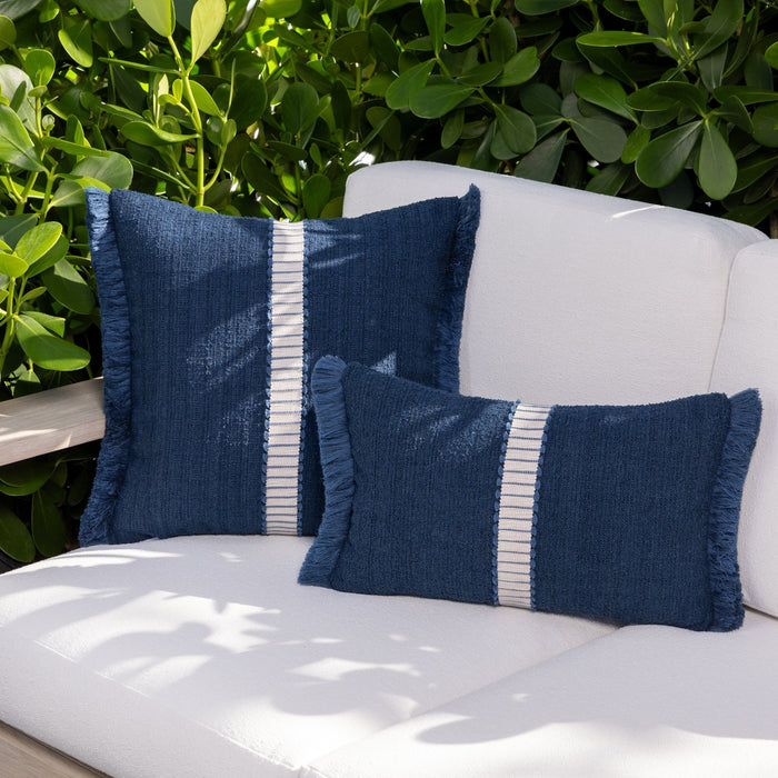 Luxury neutral striped decorative pillow on a outdoor sofa, featuring weather resistant performance fabric for indoor and outdoor use by Elaine Smith
