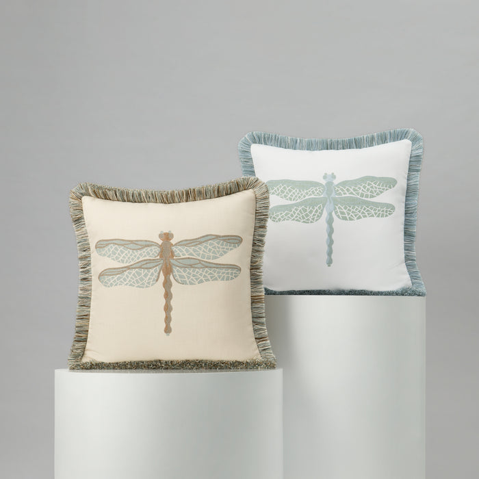 Two decorative pillows with dragonfly designs on a gray background