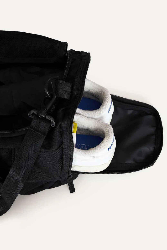 Black Fuaark Nz duffle bag with sturdy handles and spacious interior, perfect for stylish travel and weekend trips.