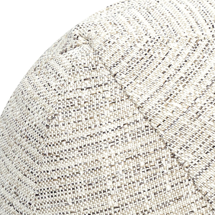 Detail image of Round ivory and black outdoor pillow with textured finish for stylish patio accents