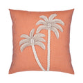 Pillow with embroidered palm trees on a coral background