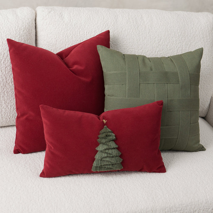 Red and green pillows on a white sofa