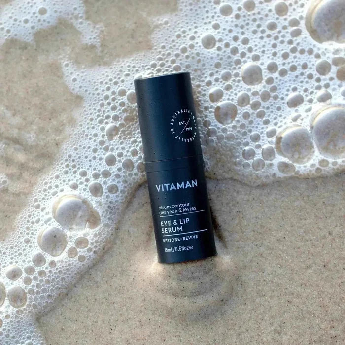 VITAMAN Australia Eye & Lip Serum for face showing the serum applicator and container, designed to reduce puffiness and fine lines.