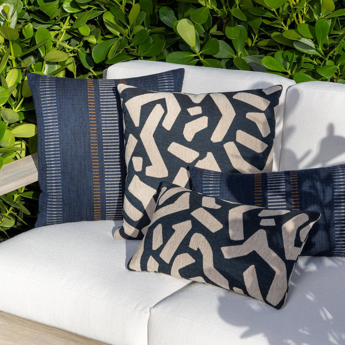 Luxury blue and white modern patterned accent pillow on a outdoor sofa, featuring tailored seams for a polished look to complete indoor and outdoor decor by Elaine Smith