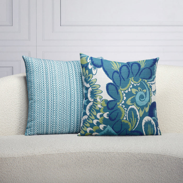 Indoor environmental image of pillows in Oversized floral pattern in blue and green for outdoor safe use – Floral Wave by Elaine Smith