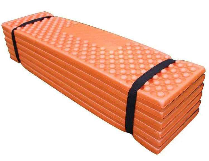 Forest green folding outdoor egg crate foam sleeping pad by Mead's Supply & Equipment Outfitters, compact and lightweight for camping.