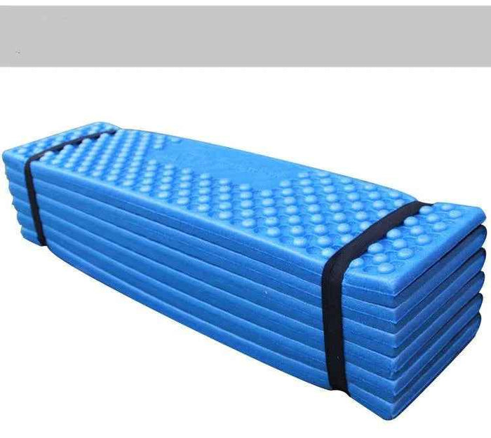 Forest green folding outdoor egg crate foam sleeping pad by Mead's Supply & Equipment Outfitters, lightweight and portable for camping.