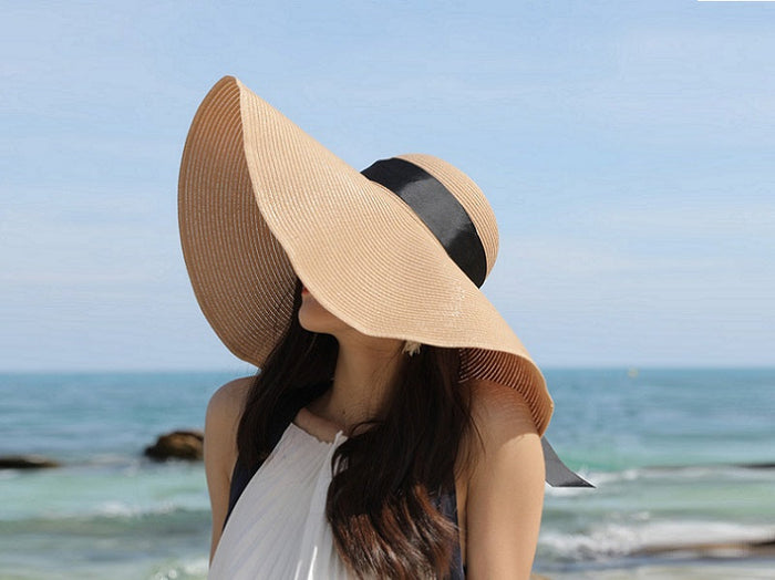 Grey women's 16cm wide brim sun straw hat with floppy derby style, perfect for summer beach or outdoor wear.