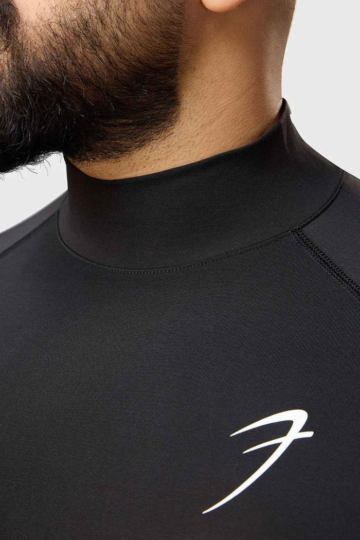 Black high-neck compression T-shirt by Fuaark NZ, showcasing a snug fit and smooth fabric for athletic support and comfort.