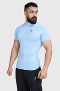 Fuaark Nz high neck compression T-shirt in Glacial Blue, close-up view highlighting stretchy fabric and fitted design.