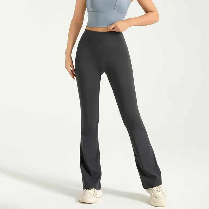 Gray high waist flared yoga pants with hip-lifting design, bell bottom style, part of women's athletic wear by Mead's Supply & Equipment.