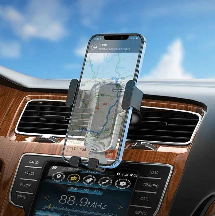 Techplus Hoco CA103 gravity car air vent phone holder with automatic clamp for 4.5–7 inch smartphones, mounted on vehicle air vent