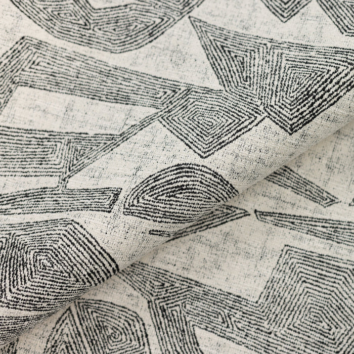 Close shot texture image of Ebony-toned geometric outdoor safe fabric with tribal-inspired design