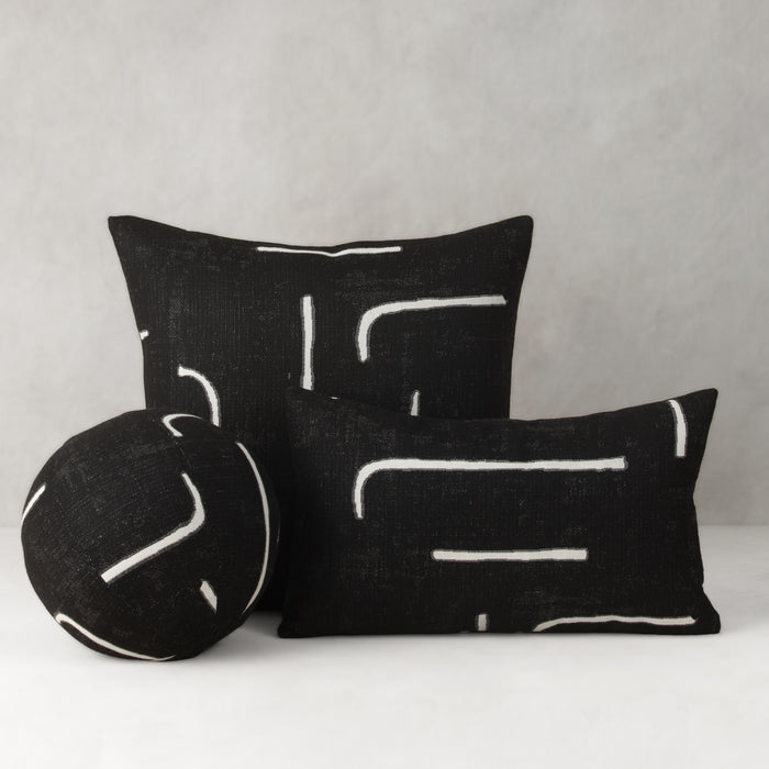 Black pillows with white patterns on a gray background- outdoor safe by Elaine Smith