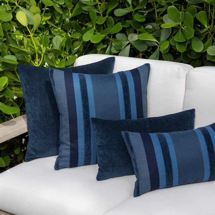 Luxury blue and navy two tone decorative pillow on a outdoor sofa, featuring commercial grade construction for luxury hotel and resort design