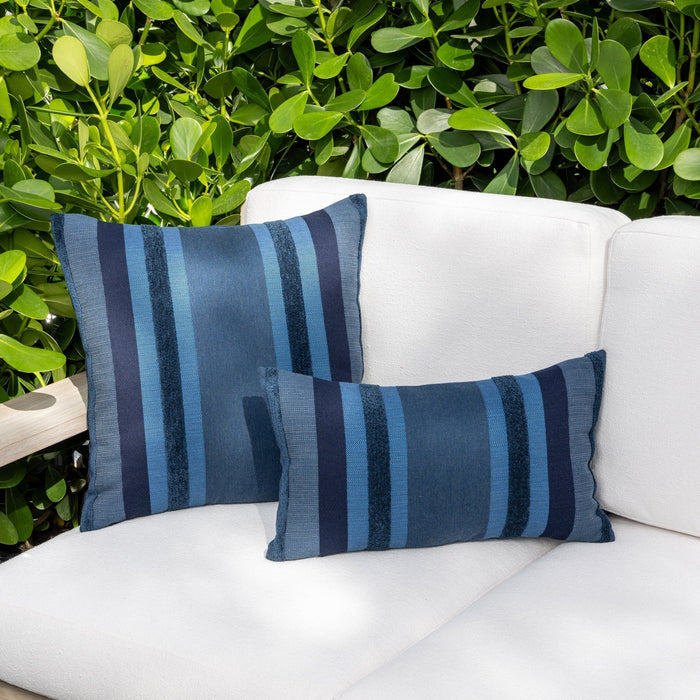 Luxury blue striped modern patterned accent pillow on a outdoor sofa, featuring commercial grade construction for luxury hotel and resort design