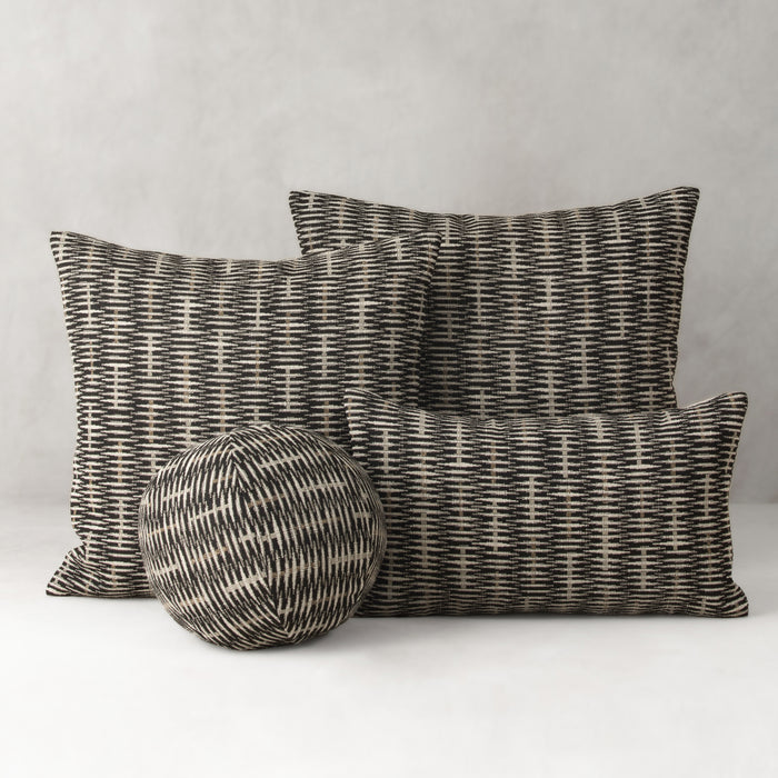 Set of woven pillows and a ball on a neutral background