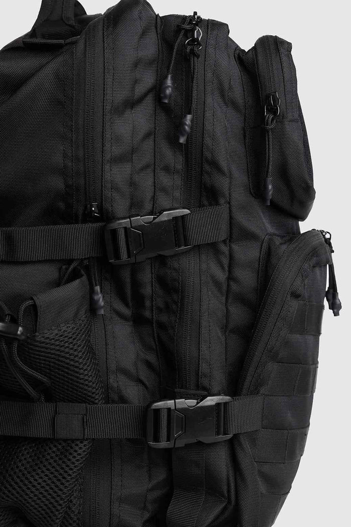 Black Ironclad Tactical Backpack by Fuaark Nz, a durable bag with multiple compartments and rugged design for outdoor use.