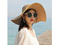 Women’s khaki straw sun hat with wide brim, floppy derby style, perfect for summer beach and outdoor sun protection.