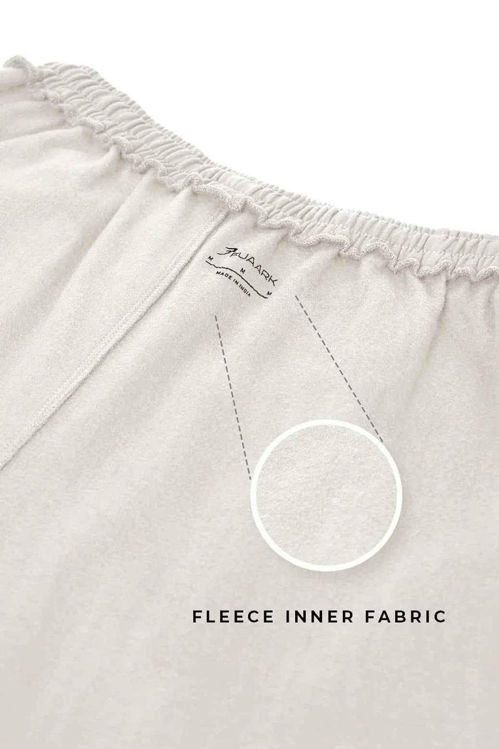 Beige laidback relaxed joggers by Fuaark NZ with a comfortable fit and casual style, shown on a model.
