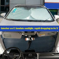 Large silver foldable car sunshade with double-circle design from dealonline.co.nz, showing the sunshade unfolded inside a vehicle.