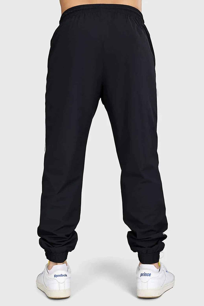 Black lifting joggers from Fuaark Nz, designed for comfortable community workouts, featuring a relaxed fit and athletic style.