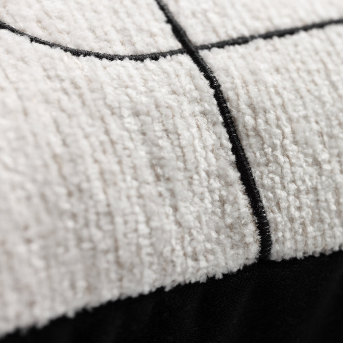 Close-up of a textured fabric with black grid lines on a white background