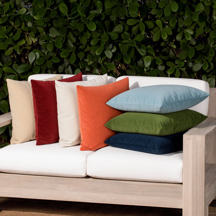 Luxury ouutdoor safe velvet accent cushions on a rooftop seating area, featuring soft touch performance weave for residential and commercial interiors