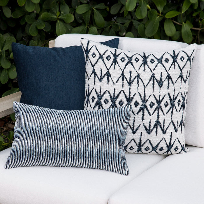 Luxury blue and white textured woven decorative pillow on a outdoor sofa, featuring tailored seams for a polished look to complete indoor and outdoor decor by Elaine Smith