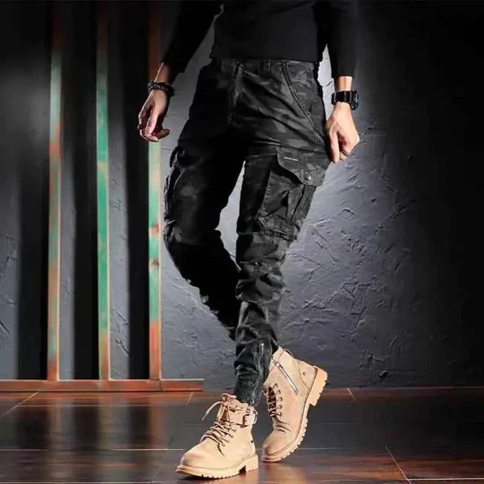 Men's oversized camouflage cargo pants by Mead's Supply & Equipment Outfitters, multi-pocket outdoor trousers in khaki.