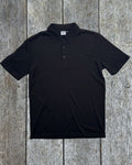 Men's black polo shirt made from 100% Merino Wool by Merino 365 NZ, showing a classic polo collar and soft fabric.
